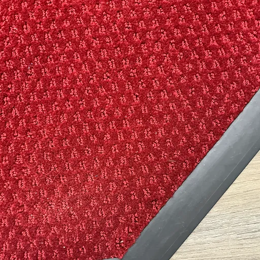 close up of textured red carpets at Salvation Army